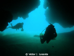 from inside of isabela caves dive site in Isabela coast,P... by Victor J. Lasanta 